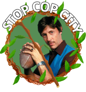 "STOP COP CITY" Uncle Rico from Napoleon Dynamite is framed with a wreath and barred by a stick as if to cross him out.